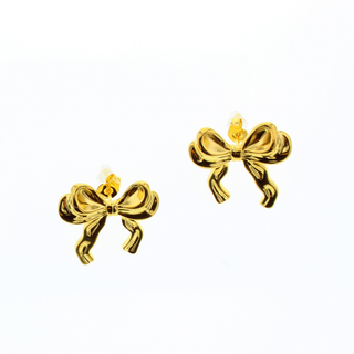 A pair of BOW WATERPROOF STUD EARRINGS by Shop-Peppermint, expertly crafted with gold plating, is showcased against a plain white background. Their intricate loop and ribbon detailing offers a delicate and elegant appearance while ensuring lasting beauty.