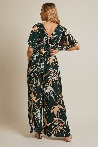 Woman wearing a floral dress with a beige background