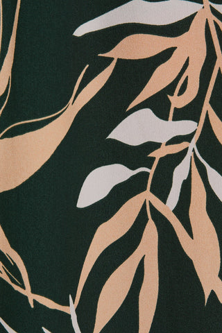 Close-up of a fabric with leaf pattern on a dark background