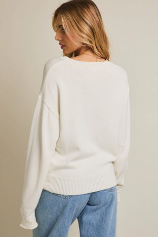 DOG HOLDING FLOWERS SWEATER